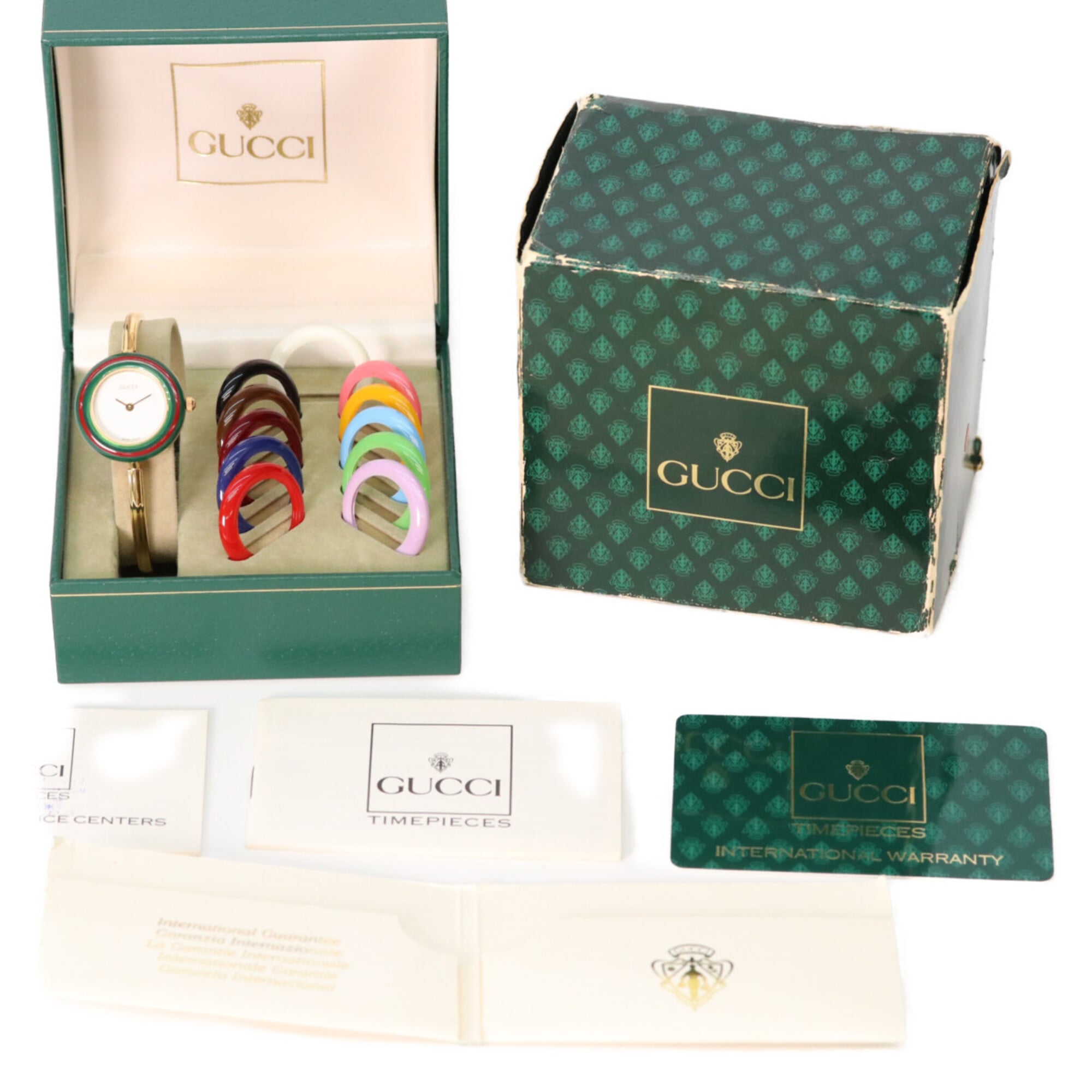 GUCCI 1100L 11 12.2 Horloge met verwisselbare rand, middelgroot, quartz, goud, witte wijzerplaat, dameshorloge