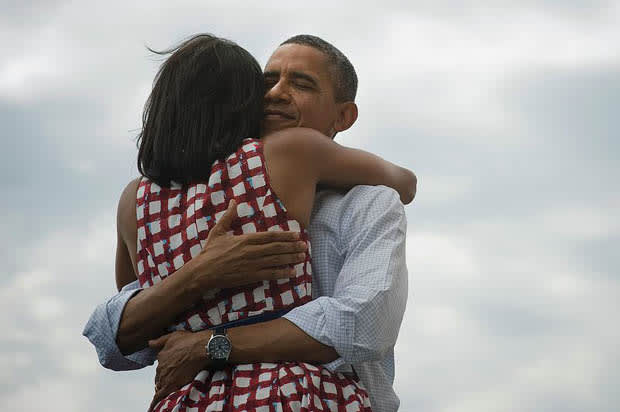 Barack hugs Michelle Obama