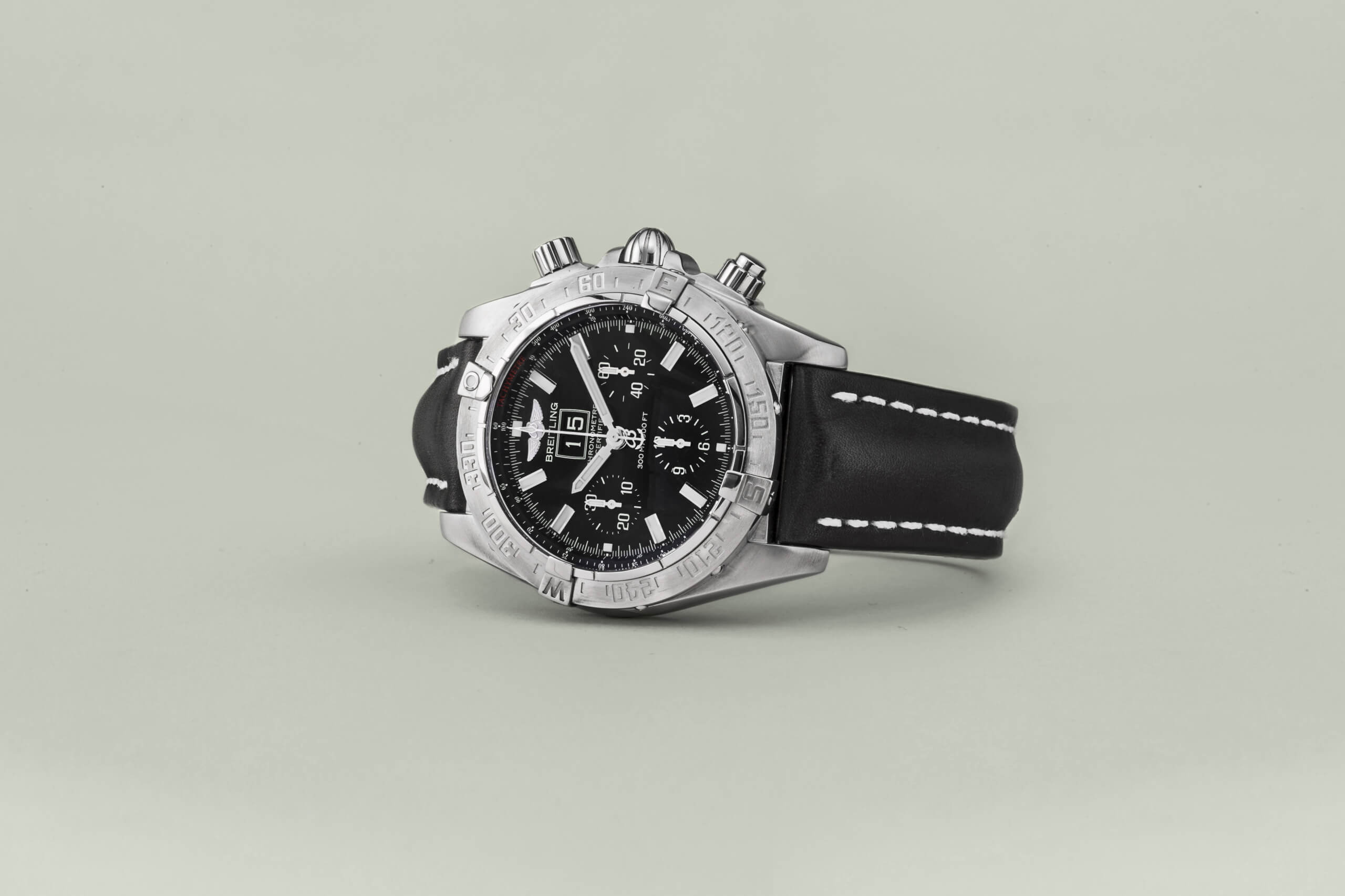 Breitling timepiece. With a black leather strap.