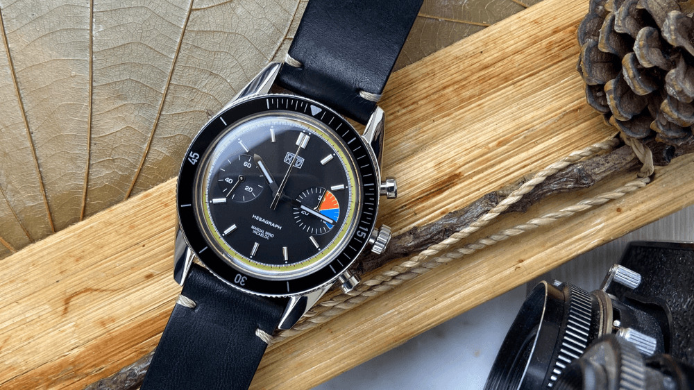 HTD Jungle watch with leather black strap, a black dial, and multicoloured complications within the dial.